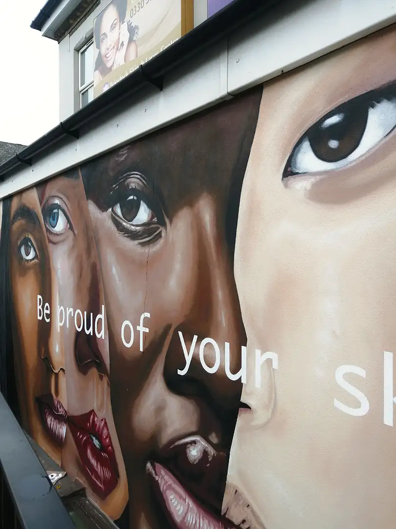 Mural for NHS Clinic Combining Multi - Ethnic Portraits with Typography